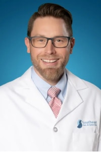 Headshot of Dr. Troy Gingerich, MD, a board-certified pain management and anesthesiologist specialist in Charlotte, NC.