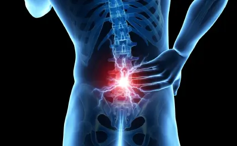 bmac-bone-marrow-concentrate Blue 3D skeletal human torso with a glowing red lower spine, illustrating area of concern to be addressed by Bone Marrow Aspirate Concentrate.