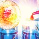 A glowing orange cell-like sphere beside a red pipette dropping fluid onto glass vials, symbolizing blood processing for autologous PRP regenerative therapy.