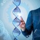 Futuristic interface with a hand reaching toward a 3D DNA strand, introducing the true cost of poor health and chronic conditions.